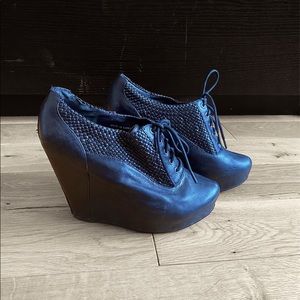 Black woven leather wedge heels